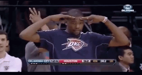 A Man Wearing A Oklahoma City Shirt Stands In Front Of A Fox Broadcast GIF