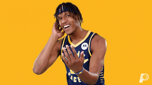A Man Wearing A Pacers Jersey Is Laughing GIF