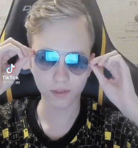 A Man Wearing A Pair Of Sunglasses With A Tiktok Watermark On It GIF