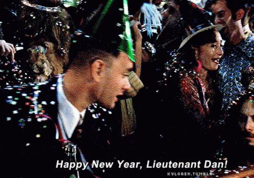 A Man Wearing A Party Hat Is Surrounded By Confetti And Says Happy New Year Lieutenant Dan GIF