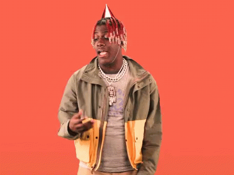 A Man Wearing A Party Hat Stands In Front Of A Red Background That Says Birthday GIF