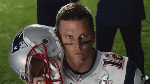 A Man Wearing A Patriots Jersey Holds A Helmet GIF