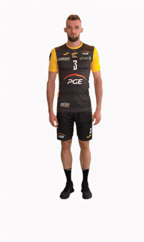 A Man Wearing A Pge Shirt And Shorts GIF