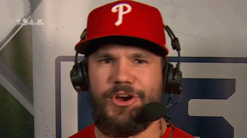 A Man Wearing A Phillies Hat And Headphones GIF