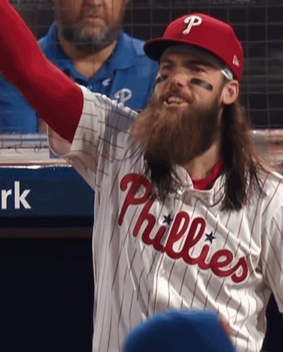 A Man Wearing A Phillies Jersey With A Beard GIF
