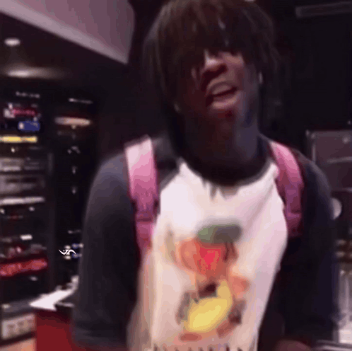 A Man Wearing A Pink Backpack And A T-Shirt With A Duck On It GIF