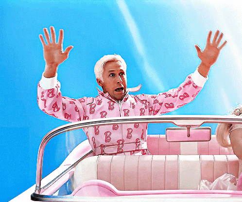 A Man Wearing A Pink Barbie Jacket Is Sitting In A Pink Car GIF