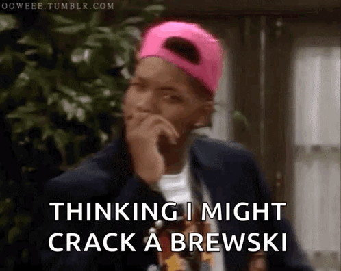 A Man Wearing A Pink Hat And A Black Jacket Is Thinking I Might Crack A Brewski GIF