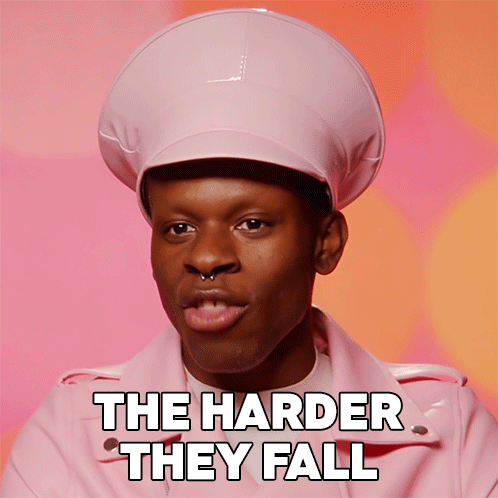 a man wearing a pink hat and a pink jacket with the words the harder they fall below him