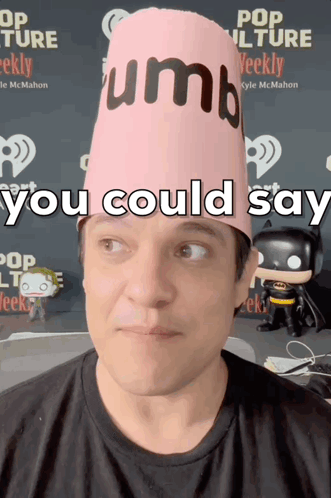 A Man Wearing A Pink Hat That Says " You Could Say " On It GIF