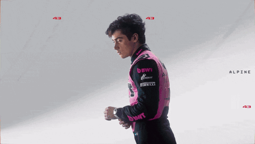 A Man Wearing A Pink Jacket With The Name Franco Colapi GIF