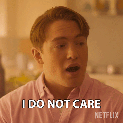A Man Wearing A Pink Shirt Says I Do Not Care GIF