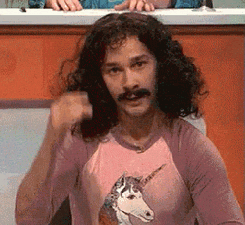 A Man Wearing A Pink Shirt With A Unicorn On It GIF