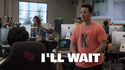 A Man Wearing A Pink Shirt With The Letter K On It GIF