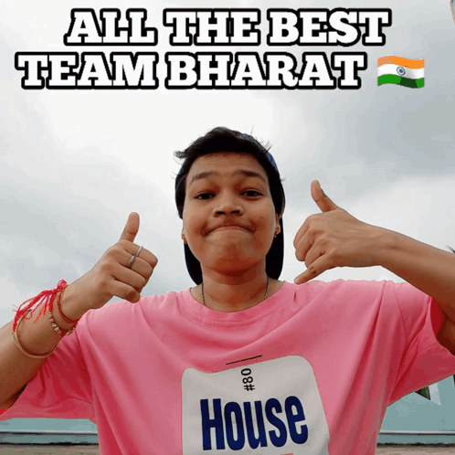 a man wearing a pink shirt with the word house on it