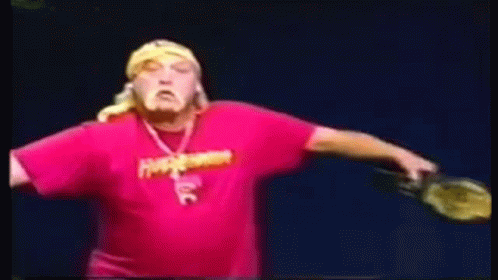 A Man Wearing A Pink Shirt With The Word Hulk On It GIF