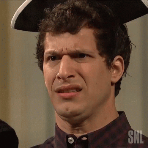 a man wearing a pirate hat and a shirt with snl written on it
