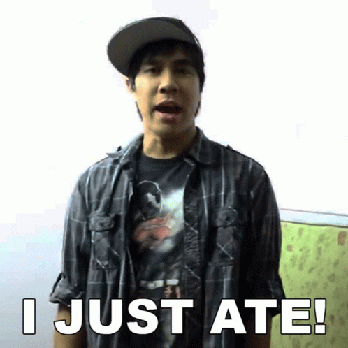 A Man Wearing A Plaid Shirt And A Hat Says " I Just Ate " GIF
