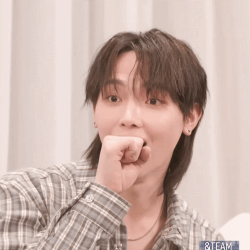 A Man Wearing A Plaid Shirt Has His Hand On His Chin And The Word Team Is On The Bottom Right GIF