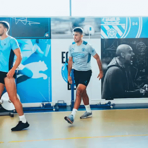 A Man Wearing A Puma Jersey Is Walking On A Basketball Court GIF