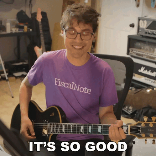 Man In Purple Shirt Playing Guitar GIF