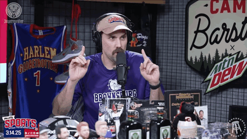 A Man Wearing A Purple Shirt That Says Brownsville Ufc Talks Into A Microphone GIF