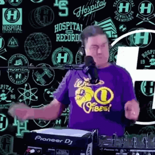 A Man Wearing A Purple Shirt That Says Hospital On It Is Dancing In Front Of A Pioneer Dj GIF