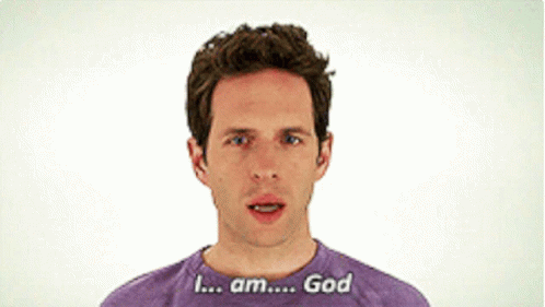 A Man Wearing A Purple Shirt That Says I Am God GIF