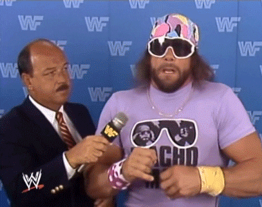 A Man Wearing A Purple Shirt That Says Macho Man GIF