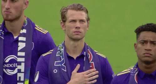 A Man Wearing A Purple Shirt That Says United GIF