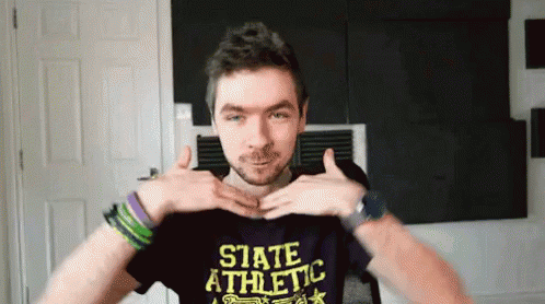 A Man Wearing A Purple State Athletic Shirt GIF