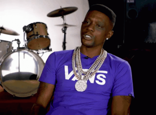 A Man Wearing A Purple Vans T-Shirt Is Sitting In Front Of Drums GIF
