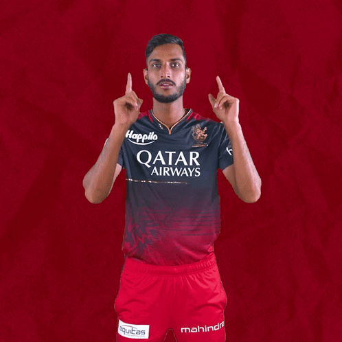 A Man Wearing A Qatar Airways Shirt Holds Up His Arms GIF