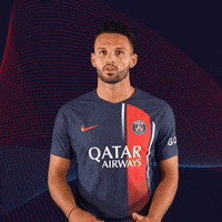 A Man Wearing A Qatar Airways Shirt Stands In Front Of A Blue And Red Background GIF
