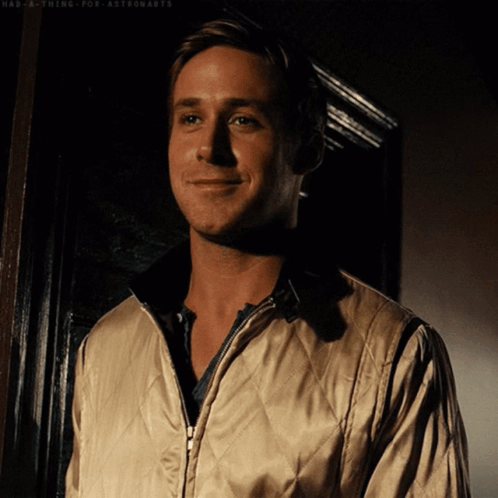 A Man Wearing A Quilted Jacket Is Smiling With The Words Had A Thing For Astronauts Below Him GIF