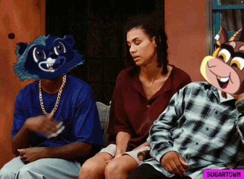 A Man Wearing A Raccoon Mask Sits Next To A Woman And Another Man GIF