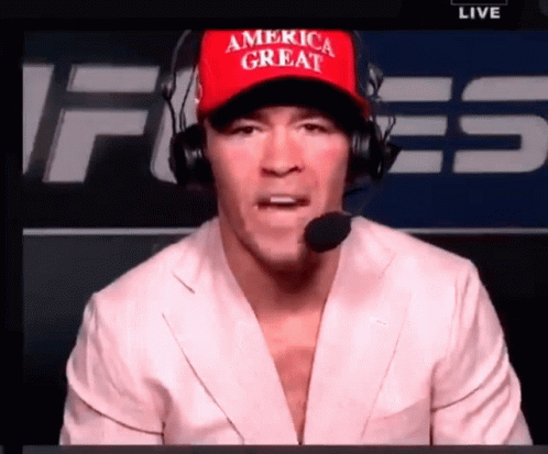 A Man Wearing A Red America Great Hat And Headphones GIF