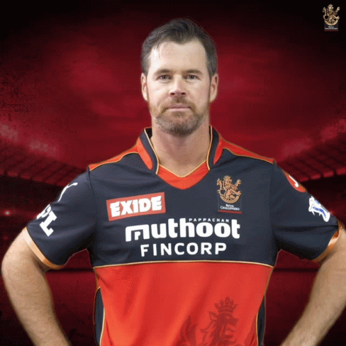 A Man Wearing A Red And Black Jersey With Exide And Muthoot Fincorp On It GIF