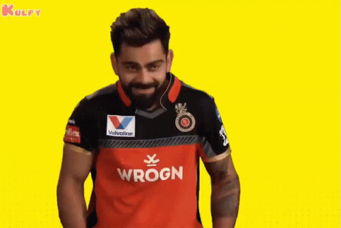 A Man Wearing A Red And Black Wrogn Shirt GIF