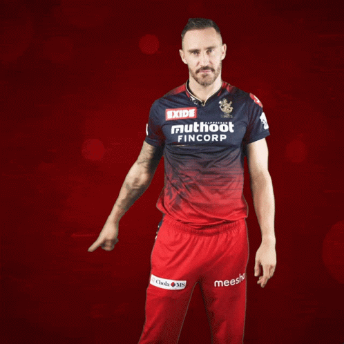 A Man Wearing A Red And Blue Shirt That Says Exide Muthoot Fincorp GIF