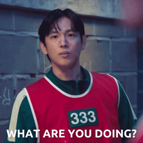 A Man Wearing A Red And Green Vest With The Number 333 On It Says What Are You Doing GIF