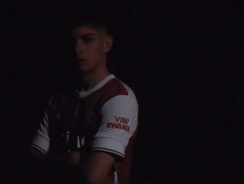 A Man Wearing A Red And White Emirates Shirt GIF