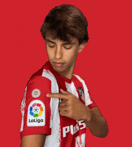 A Man Wearing A Red And White Laliga Shirt Points To His Sleeve GIF