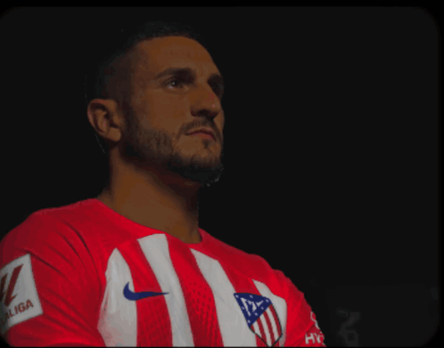 A Man Wearing A Red And White Striped Shirt That Says Laliga On The Sleeve GIF