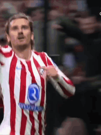 a man wearing a red and white striped shirt with the letter r on the front