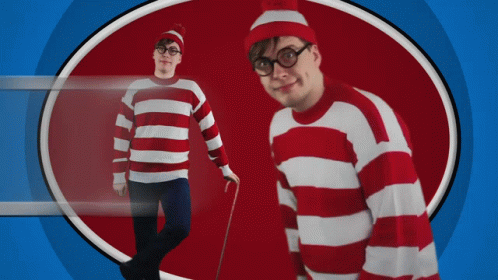 A Man Wearing A Red And White Striped Sweater And Hat GIF