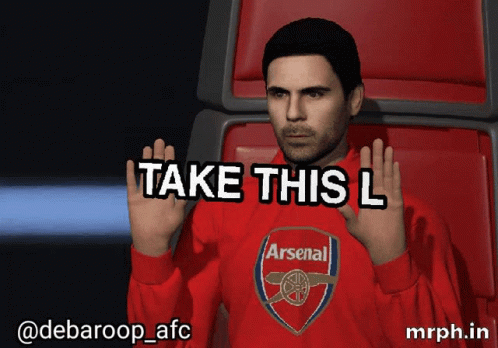 A Man Wearing A Red Arsenal Shirt Is Sitting In A Chair GIF