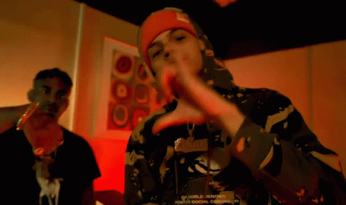 A Man Wearing A Red Bandana On His Head Making A Face GIF