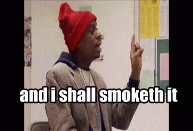 A Man Wearing A Red Beanie And A Suit Says " And I Shall Smoketh It " GIF