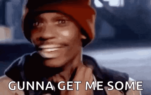 A Man Wearing A Red Beanie Is Smiling And Saying Gunna Get Me Some . GIF